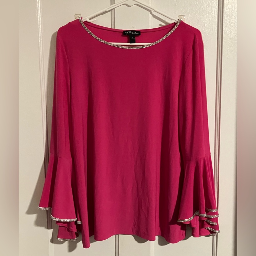 Stretchy hot pink shirt with flare sleeves and rhinestone trim